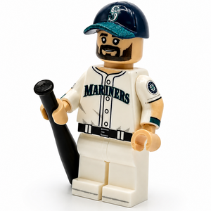 A LEGO baseball minifigure wearing a Seattle Mariners uniform, holding a black bat, on a white background.